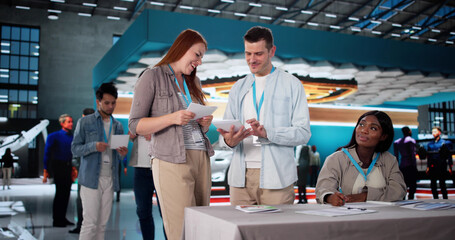 Engaging Audience At Trade Show: Saleswoman Presents Diverse