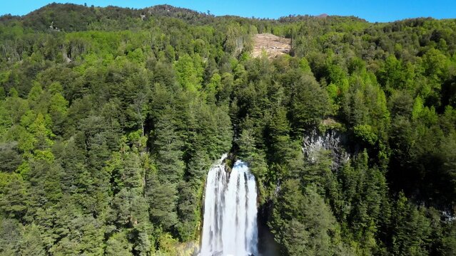 Dron view of waterfall near heart shape lagoon Laguna corazon in Chile. Waterfall near Lican Ray