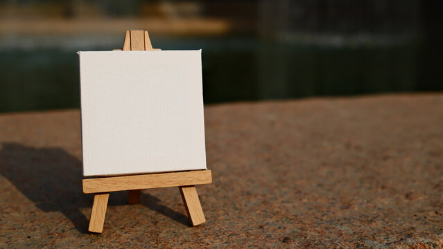blank mini easel close up on granite surface with copy space
