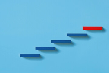 Concept of building success foundation. wooden block stacking as step stair, Success in business growth concept on pastel background.