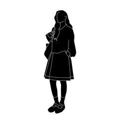 Silhouette of a young woman standing casually with one hand in her pocket and the other holding her bag.