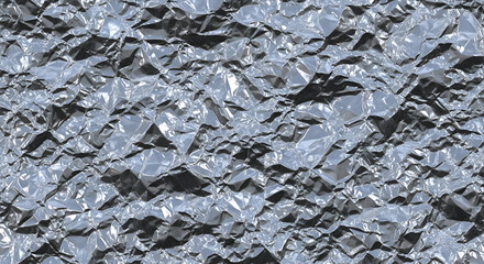 Crumpled aluminum foil reflects light creating abstract patterns and textures in a closeup shot, highlighting metallic sheen and industrial feel.