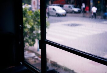 Rainy Day City View Through Window Pane