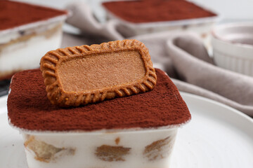 Tiramisu dessert box with biscuit topping.