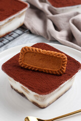Tiramisu dessert box with biscuit topping.