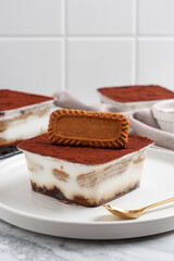 Tiramisu dessert box with biscuit topping.
