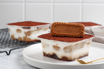 Tiramisu dessert box with biscuit topping.