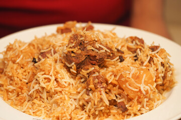Delicious rice dish with tender meat and spices served warm