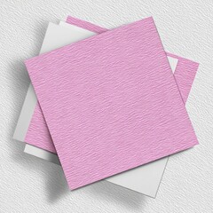 Pink square notepads layered, textured surface