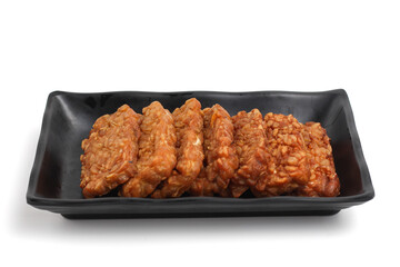 Tempe. Fried tempeh isolated on white background. fermented soy bean.