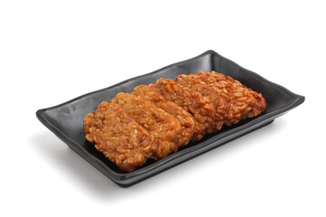 Tempe. Fried tempeh isolated on white background. fermented soy bean.