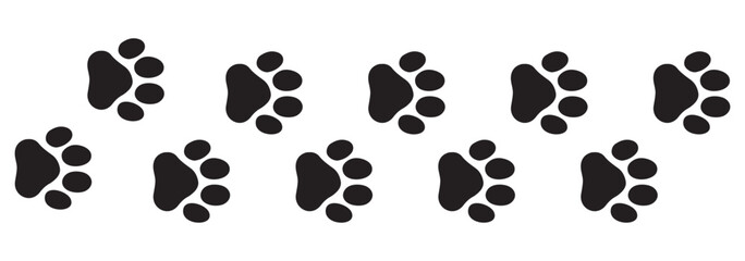 Seamless vector pattern of diverse animal paw prints, including dog, cat, and bear footprints, in a black silhouette design