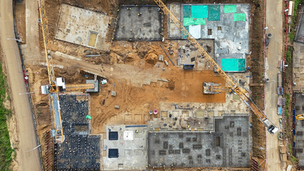 Construction site aerial. View from the height of the construction site. Real estate construction. Construction industry. High quality photo