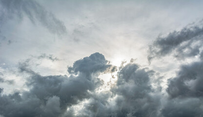 White fluffy clouds scattered across a deep blue sky creating a bright and airy weather background with natural light