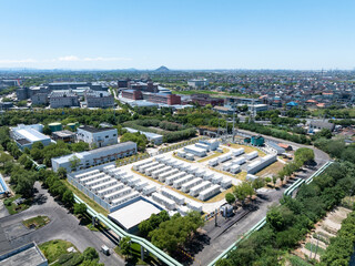 Aerial view of battery energy storage systems under a clear blue sky