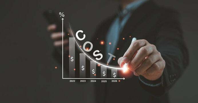 Businessman pointing at cost reduction graph with glowing arrow showing decreasing expenses financial savings business efficiency investment growth and corporate budget strategy concept.