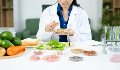 Nutrition expert in lab coat presenting soybeans and almonds in petri dishes. Healthy food, protein, diet, and food science concept. Clinical setting