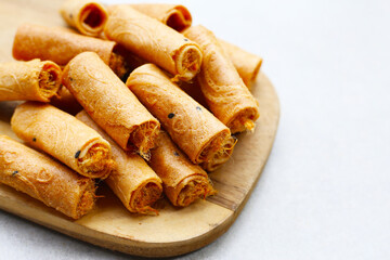 Rolled crispy wafers filled with shredded pork floss, Thai snack.
