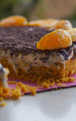 Chocolate cake with a slice of tangerine