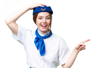 Airplane stewardess over isolated chroma key background surprised and pointing finger to the side