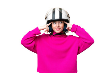 Young pretty woman with a motorcycle helmet over isolated chroma key background having doubts and thinking