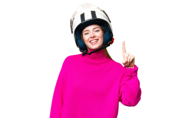 Young pretty woman with a motorcycle helmet over isolated chroma key background showing and lifting a finger in sign of the best