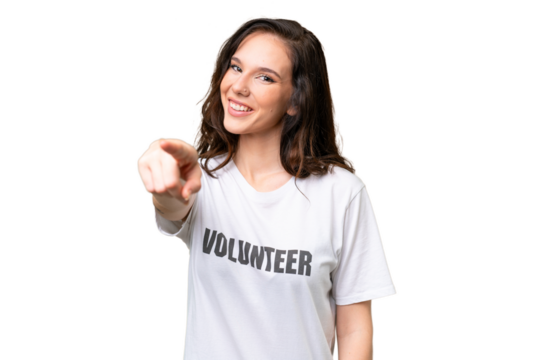 Young volunteer caucasian woman over isolated background pointing front with happy expression