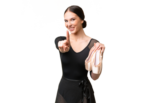 Young caucasian woman practicing ballet over isolated background showing and lifting a finger