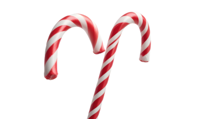Two classic red and white candy canes on a transparent backdrop, highlighting its festive association with winter and Christmas