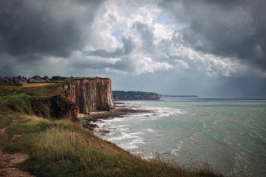Scenic coastal view featuring dramatic cliffs under a stormy sky with waves crashing on the shore