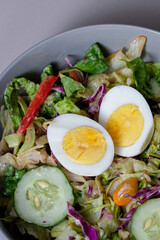 Healthy raw vegetable salad with boiled egg