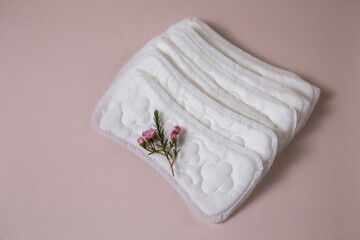 Women's sanitary pads on a pink background
