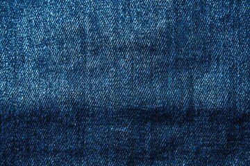 Blue denim fabric featuring a tightly woven twill pattern