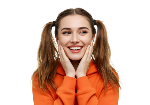 A young woman with pigtails smiles with her hands on her cheeks, looking away from the camera