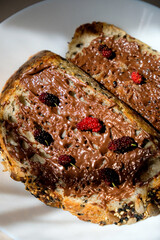 Sourdough bread with chocolate spread and mulberry topping for breakfast