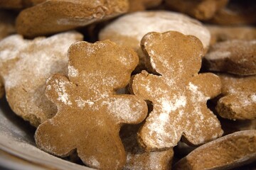 Close-up of traditional homemade gingerbread cookies served on a plate. Christmas festive concept with cozy holiday mood.