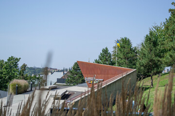 A memorial is visible among the grass.