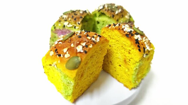 wholemeal bread resh buns with different seeds on white background. 