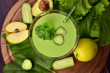 Green smoothie. Flat lay. Green smoothie with organic ingredients, vegetables. 