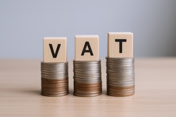 VAT Concept with Rising Stacks of Coins - Value Added Tax Implications on Financial Growth