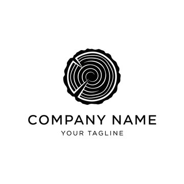 Minimalist black and white logo design of a wood log cross-section with tree rings for a company brand.