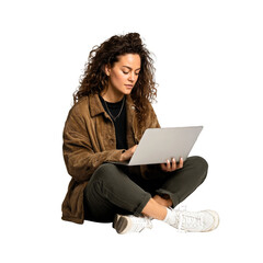 A woman is sitting on the floor with a laptop in front of her