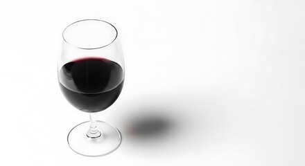 Elegant red wine glass on crisp white, minimalist design presentation