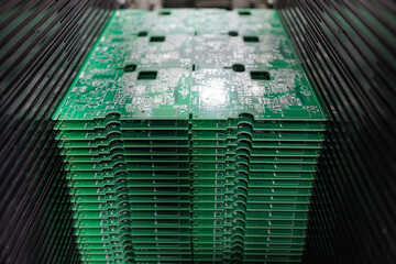Stack of PCB panels in SMT loader ready for automated SMD placement