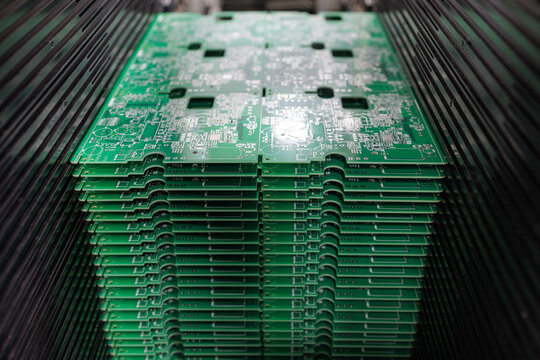 Stack of PCB panels in SMT loader ready for automated SMD placement