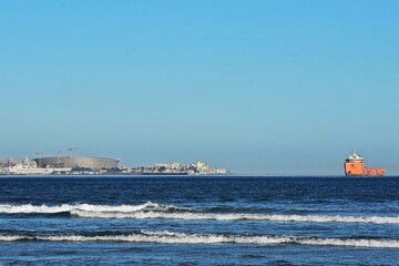 Landscape with the Cape Town Stadium and a red ship
