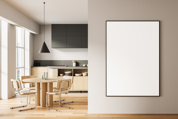 Modern dining room and kitchen interior with wooden furniture and vertical blank poster mockup on beige wall for artwork or design presentation concept. 3D Rendering
