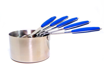 Measuring cups together on white background