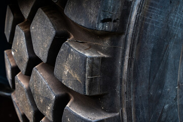 Close-up. Tractor or dump truck tire tread. Wheels for large machines.