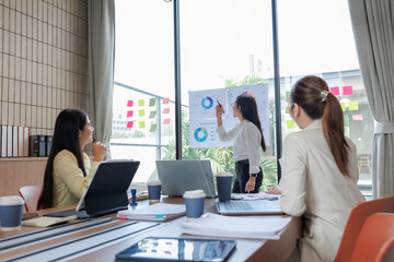 Businessmen and women discussing contract terms with determination.